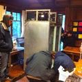 Ezra Pergam and team moving old refrigerator